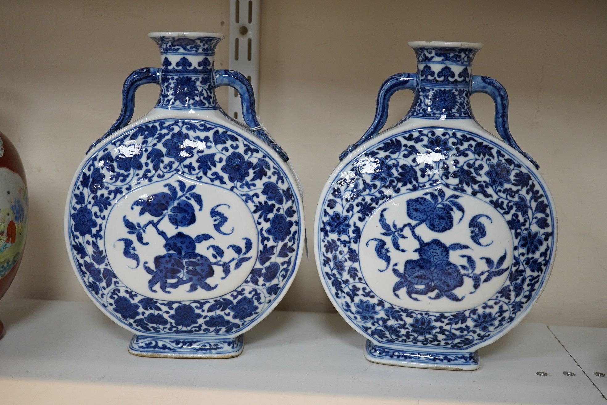 A near pair of Chinese blue and white moonflasks, bianhu, Daoguang seal marks and of the period (1821-50)